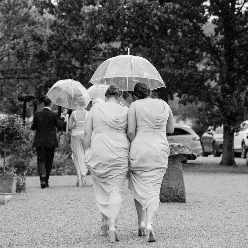 Bridesmaids, rainy wedding photo