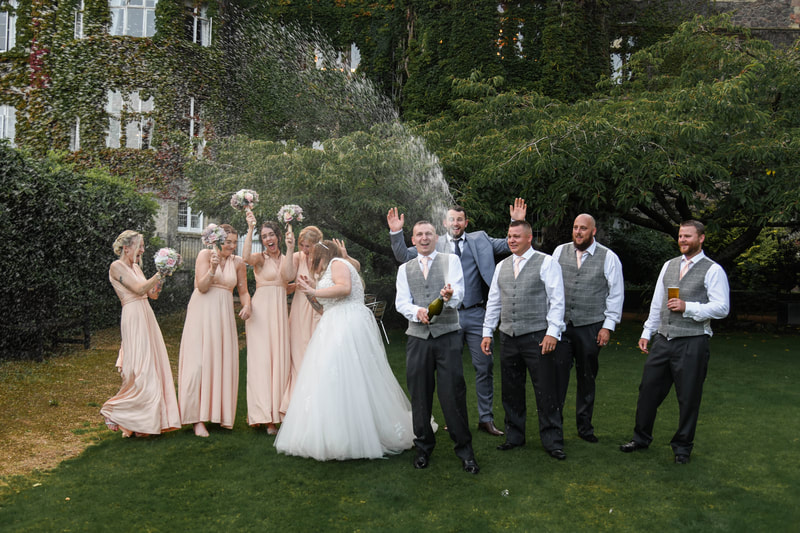 Champagne spray with the wedding party, Abbey Hotel Malvern.