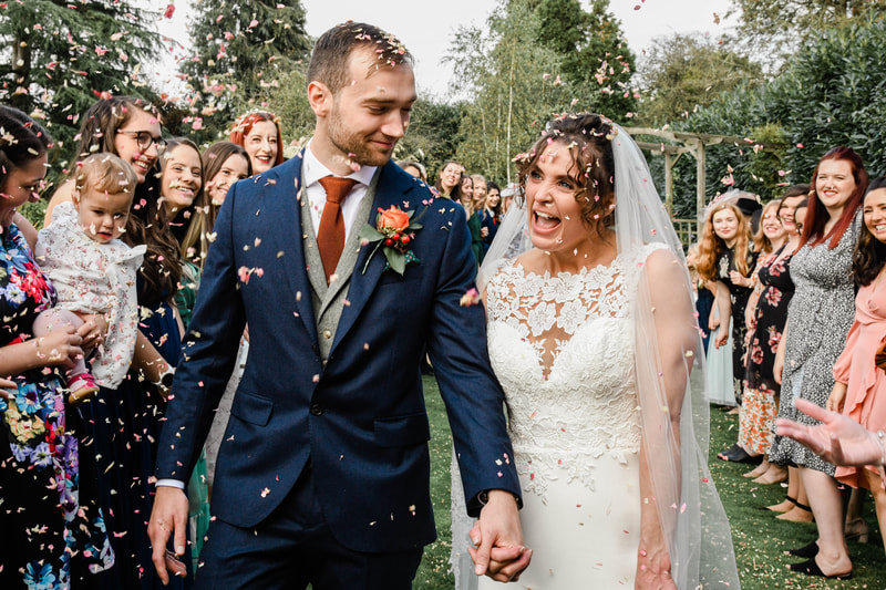 Bride and groom confetti throwing, redhouse barn